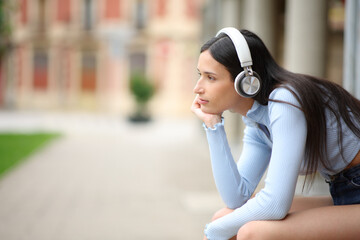 Woman with headphone listening podcast