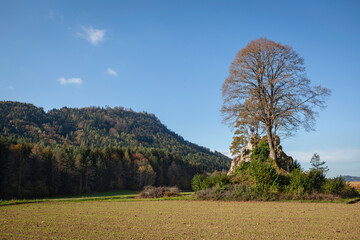 Famous archaeological site Hemmaberg in Carinthia with the cross on the rock in the foreground, Austria