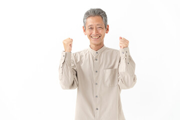 ガッツポーズをするシニア男性