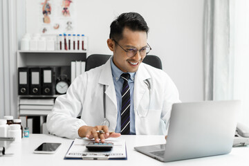 Doctor working in hospital use calculator, Healthcare and medical concept.