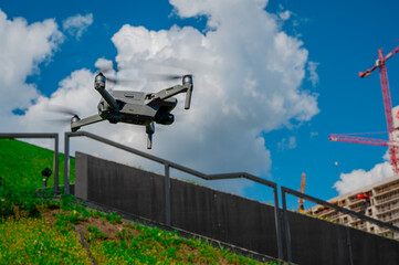 Technology drone with camera on urban background.