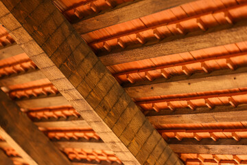 The interior inside of a tiled roof. Construction industry of a rustic mountain cabin.