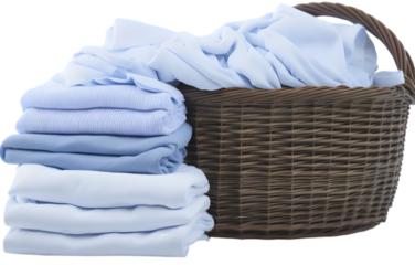 Stack of clean clothes and Wicker basket with clean laundry on transparent background PNG high quality 