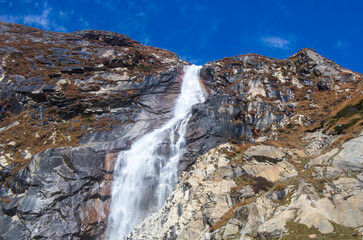 Fototapeta na wymiar Mountain and Graceful Waterfall. Khando waterfall in Kanchenjunga trek. 