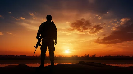 Foto op Plexiglas Soldier with a weapon silhouette against sunset © Yuwarin