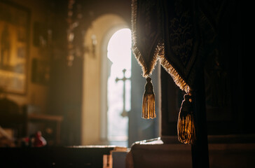 Bright sunlight streams through the windows of the Orthodox church. The concept of religion, belief...