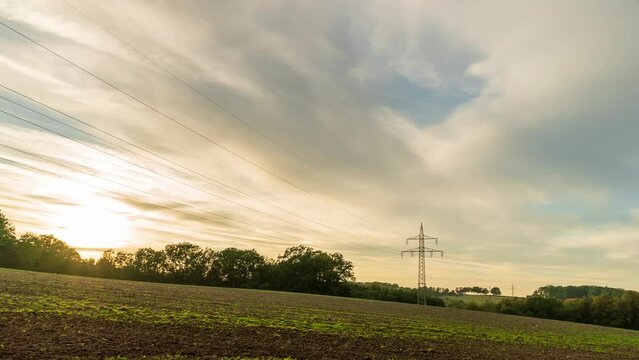 4k  autumnal sunset in Gerlingsen, Iserlohn, Germany. Fast floating clouds against the background of the setting sun.