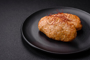 Delicious fried cutlets or meatballs with salt, spices and herbs