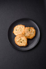 Delicious fried minced fish cutlets or meatballs with salt, spices and herbs