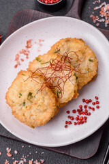 Delicious fried minced fish cutlets or meatballs with salt, spices and herbs