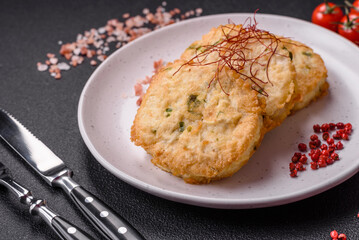 Delicious fried minced fish cutlets or meatballs with salt, spices and herbs