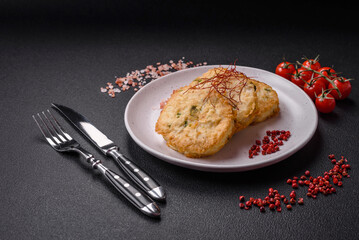 Delicious fried minced fish cutlets or meatballs with salt, spices and herbs
