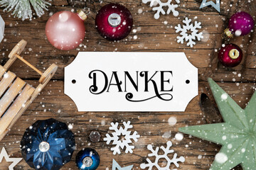 Fototapeta na wymiar Festive And Snowy Christmas Background With German Text Danke