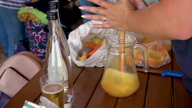 Lady Mixing a Traditional and Typical Portuguese Alcoholic Drink called Poncha in Slowmotion