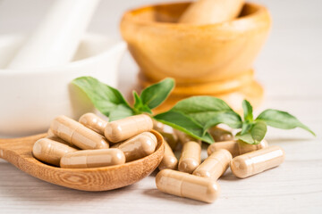 Alternative medicine herbal organic capsule with vitamin E omega 3 fish oil, mineral, drug with herbs leaf natural supplements for healthy good life.