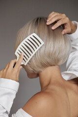 Happy Woman with Blond Hair in Casual Clothing and Fashionable Hairstyle