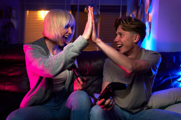 Team of caucasian friends playing video game with game pads © gpointstudio