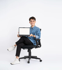 Full body of young Asian man using laptop on white background