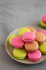 Colorful Homemade French Macarons on a Plate, side view. Copy space.