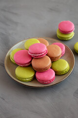 Colorful Homemade French Macarons on a Plate, side view.