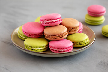 Fototapeta na wymiar Colorful Homemade French Macarons on a Plate, low angle view.