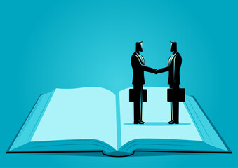 Symbolic image of two businessmen shaking hands while standing on the same page of an open book, represents alignment, and shared goals. It conveys the importance of being on the same page for success