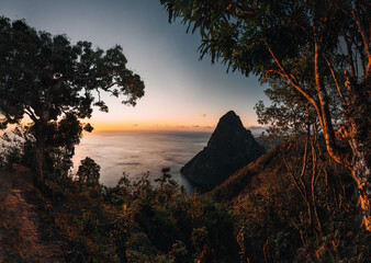A view of the mountains from Petit and Gros Piton on Saint Lucia in the Caribbean under blue skies...