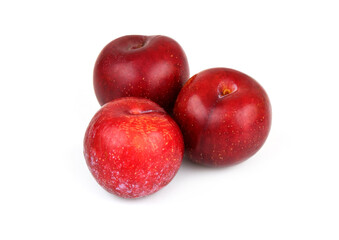 Red plums isolated on white background