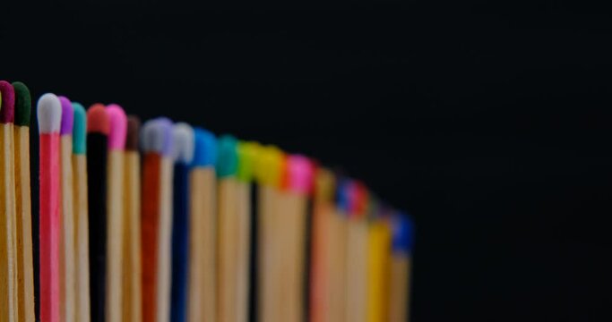 Still shot of colored matchsticks, with shallow depth of field and focus transition