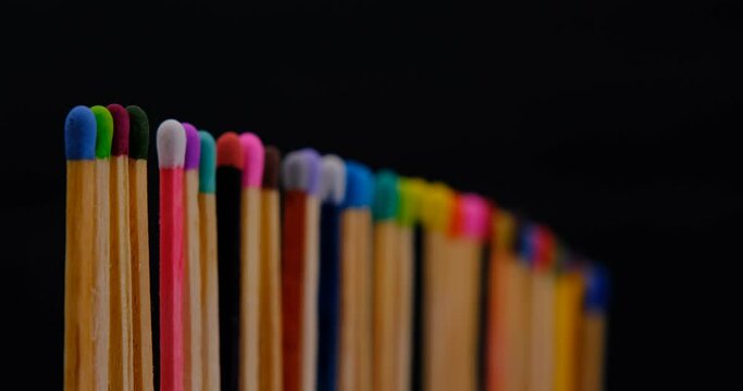 Still shot of colored matchsticks, with shallow depth of field and focus transition
