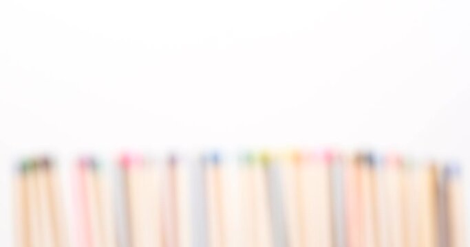 Still shot of colored matchsticks, with shallow depth of field and focus transition