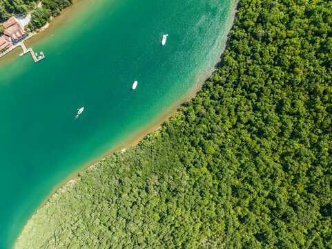 Aerial view of boats sailing along the Limski Fjord (Canal di Leme) in Sveti Lovrec, Istria, Croatia.