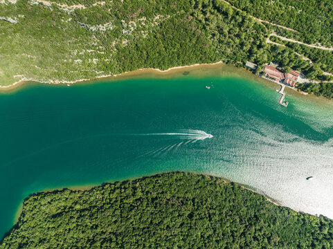 Aerial view of boats sailing along the Limski Fjord (Canal di Leme) in Sveti Lovrec, Istria, Croatia.