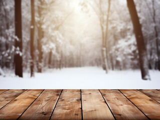 Wooden deck in foreground, snowy forest background with bright light shining through trees.