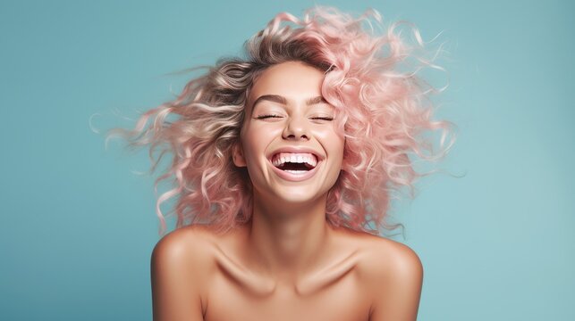 The portrait of happy woman in blue background
