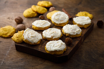 Homemade pumpkin cookies with walnut and cream cheese