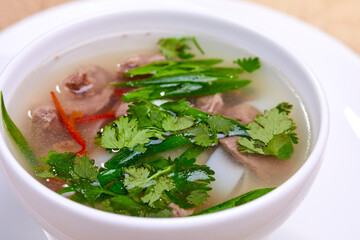 tasty asian soup in bowl on table