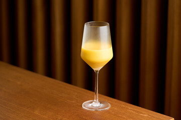 Classic cocktail glass with fresh grapefruit on wooden table