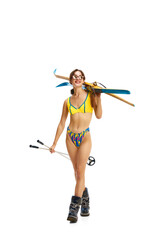 Snowboarder. Excited woman wear black ski suit goggles swimsuit and sunglasses spend extreme weekend isolated white studio background.