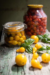 red and yellow cherry tomatoes in a jar for winter