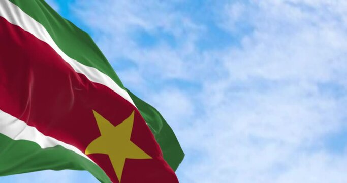 Suriname national flag waving in the wind on a clear day