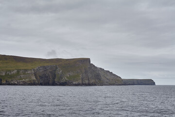High cliffs of Shetland islands in Scotland.