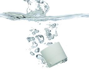 Cosmetic container fall into clear water with air bubble. Small cosmetic treatment container drop...