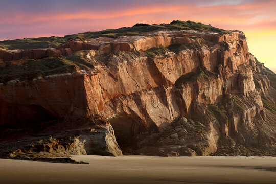 landscape with cliff at the beach near Peniche in Portugal during sunset