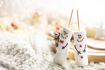 Fotobehang Winter composition with a cup of cocoa and marshmallows on a blurred background. © puhimec