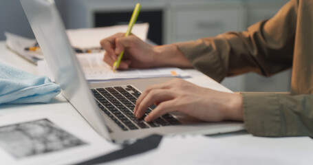 Close Up Footage of Korean Financial Regulator's Hands Expertly Navigating the Laptop Keyboard, Ensuring Compliance, Analyzing Financial Data and Safeguarding Regulatory Standards