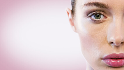 Creative Advertisement Template For Cosmetics Concept: Close-Up Half-Face View Of Beautiful Woman With Makeup And Looking At The Camera on Pink Background. Ad Mockup For Social Media Marketing.