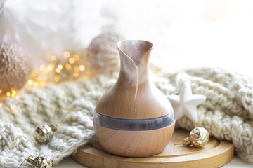 Christmas still life with an aroma diffuser for moisturizing the air.