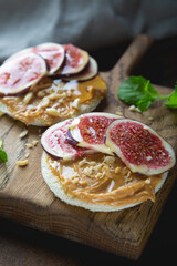 Whole grain bread with peanut butter and fresh figs