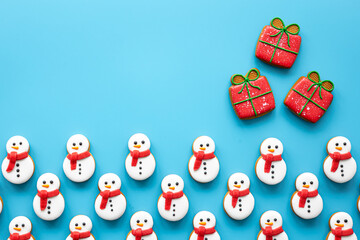 Christmas gingerbread on a blue background, flat lay.